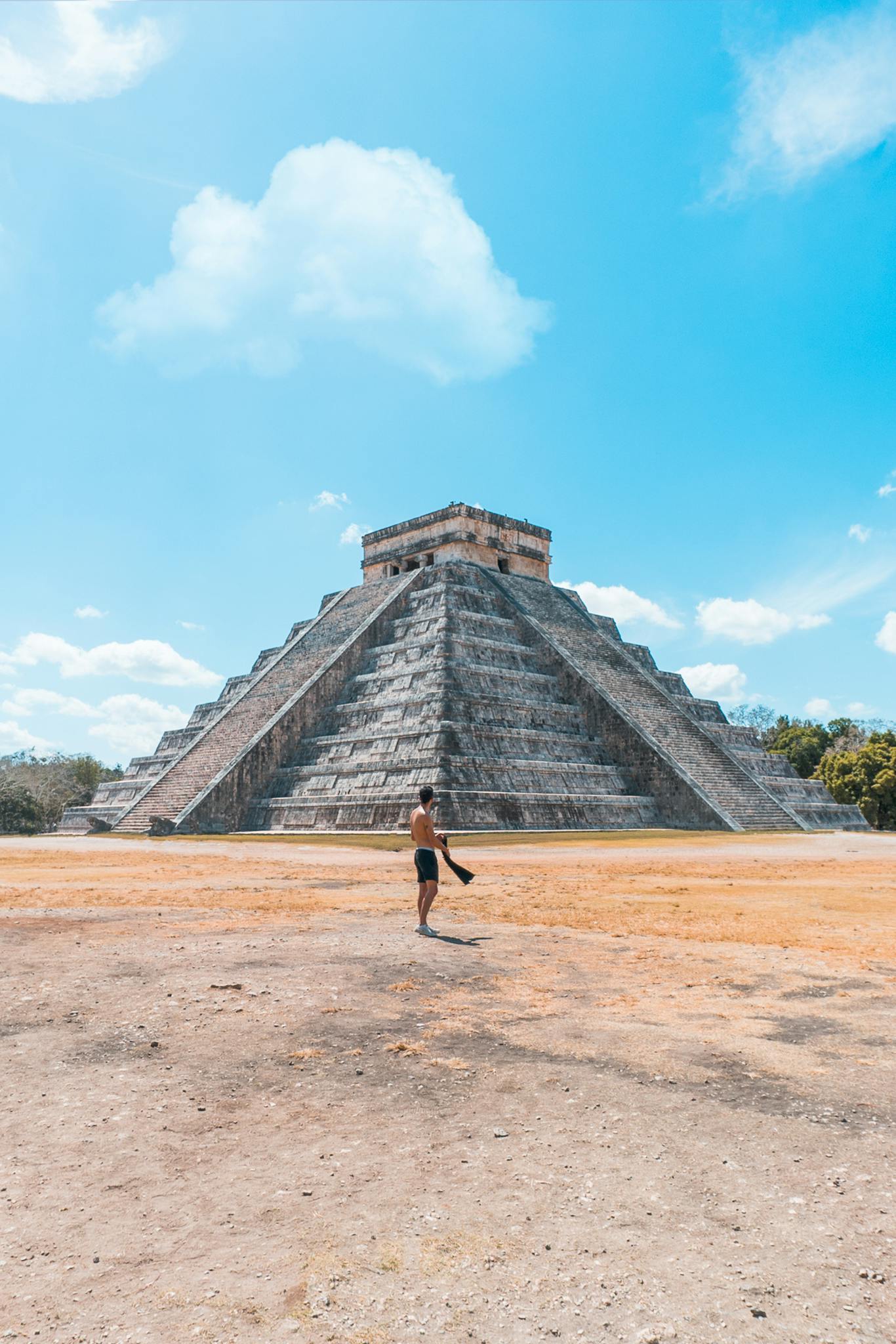A tourist explores the grand pyramid of Chichen Itza, a UNESCO World Heritage Site in Mexico.